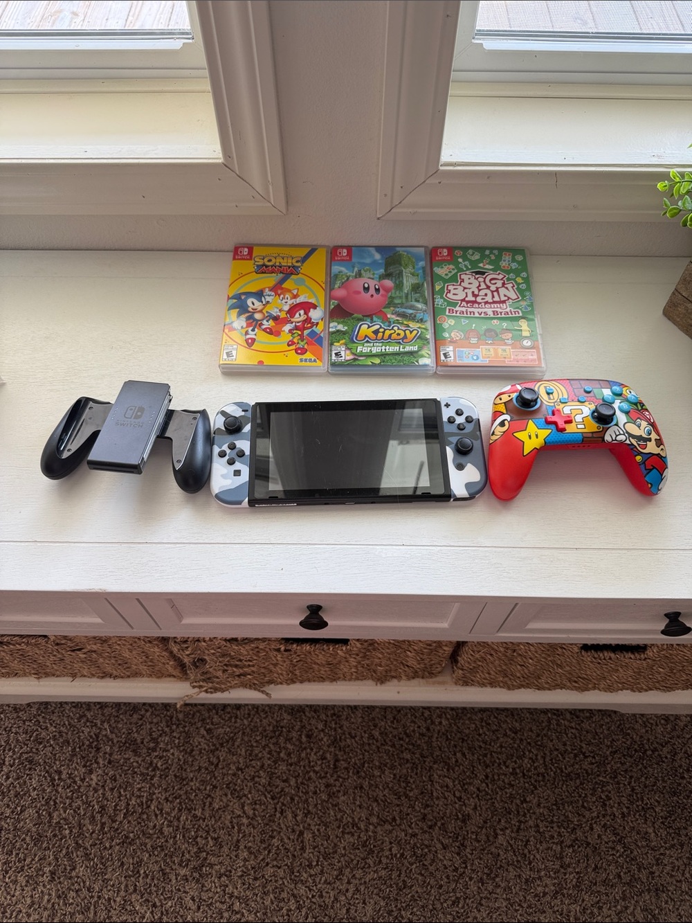 Nintendo Switch with three games and two controllers
